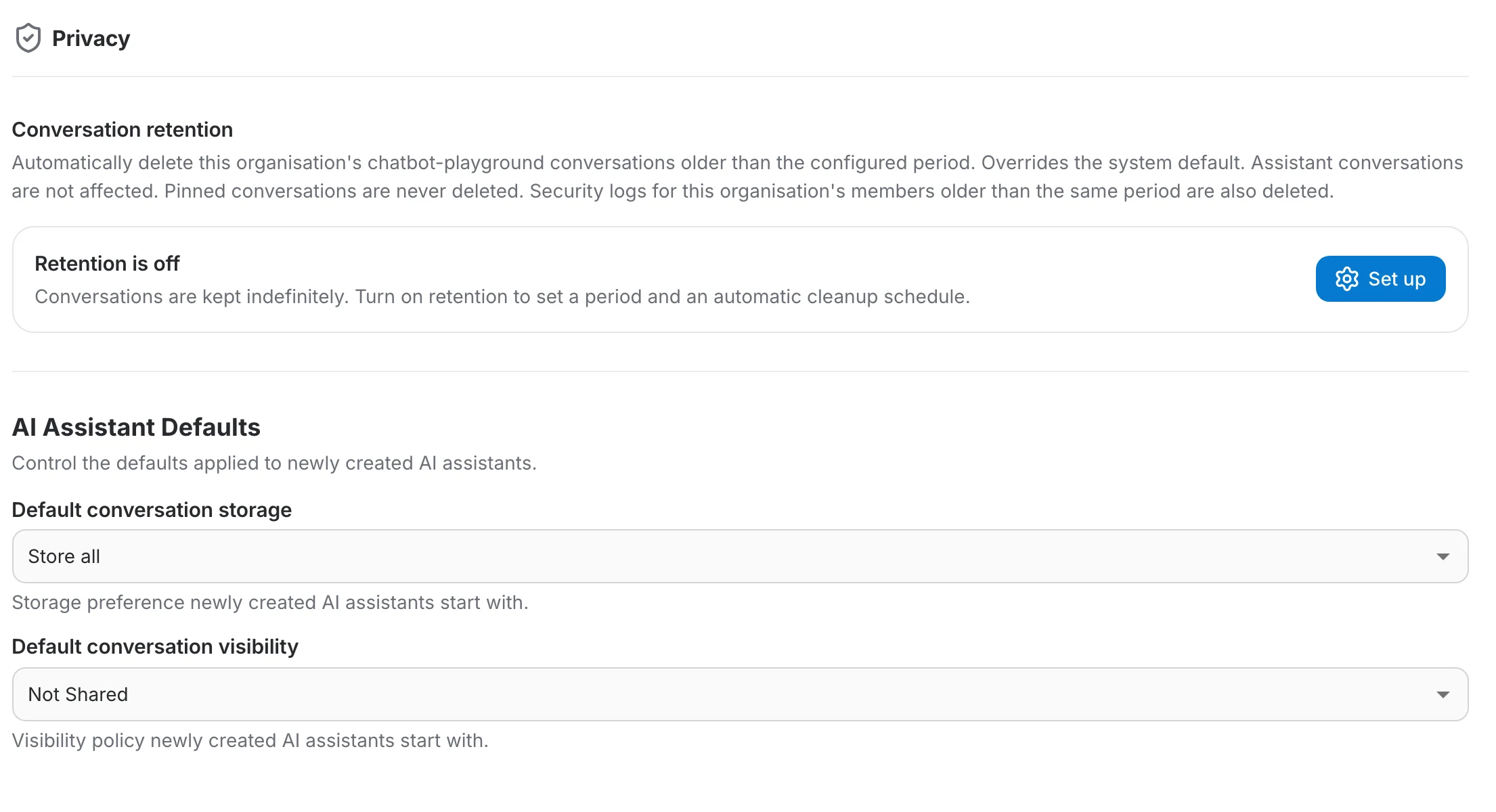 The Privacy page with conversation retention off and the AI Assistant Defaults section below it